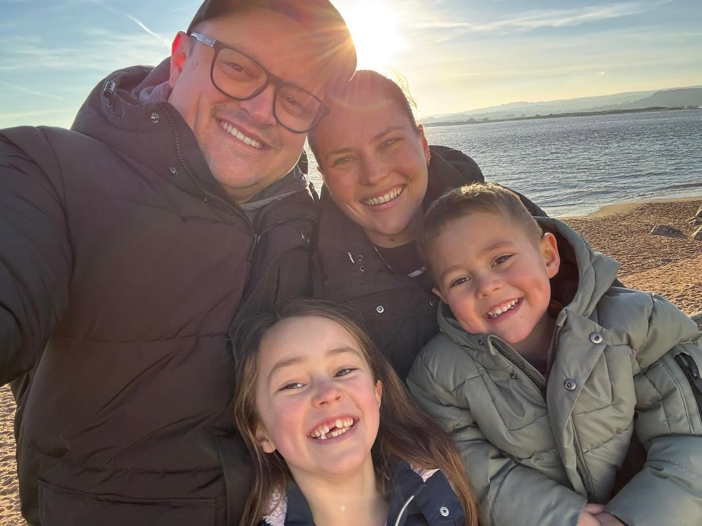 Nicole Duley with her family on the beach